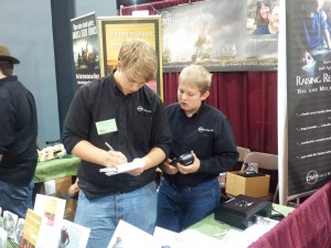 Training the next brother to work the booth.