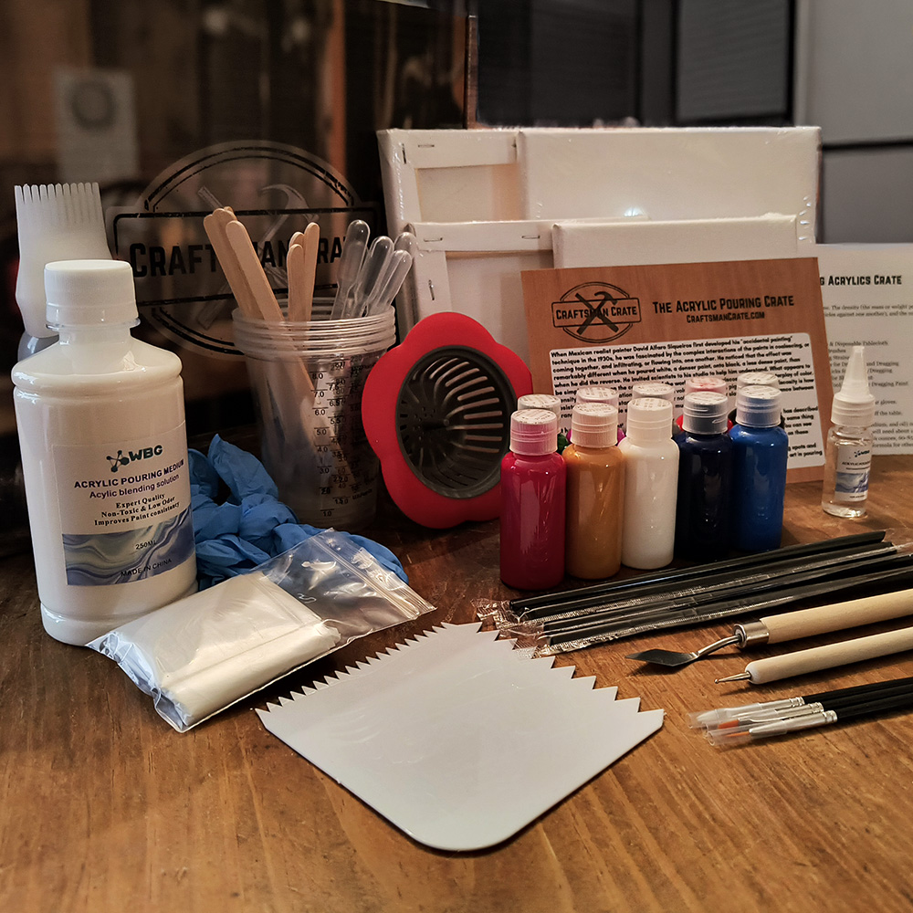 Acrylic Pouring Crate Displayed 1000x1000 Craftsman Crate Acrylic Pouring Crate with four stretched canvases, acrylic paints, pouring medium, box, splash card, instructions, and numerous tools and brushes.